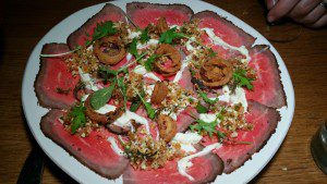 Charcoal Grilled Beef Carpaccio with stracciatella, cauliflower and crispy shallots
