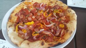 Carnivoro Pizza (hot Calabrese sausage, pepperoni, smoked bacon, red onion, sweet cherry peppers)